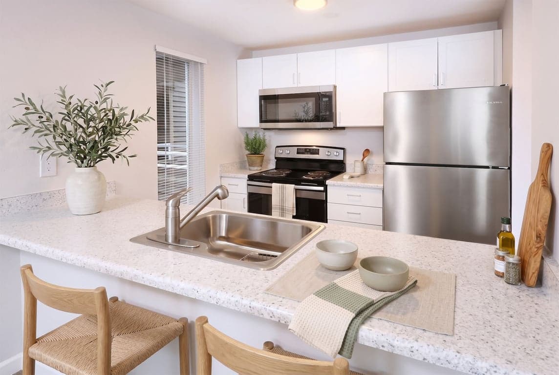 Westwood Court Seattle 1-bedroom apartment living room with large windows and hardwood floors.